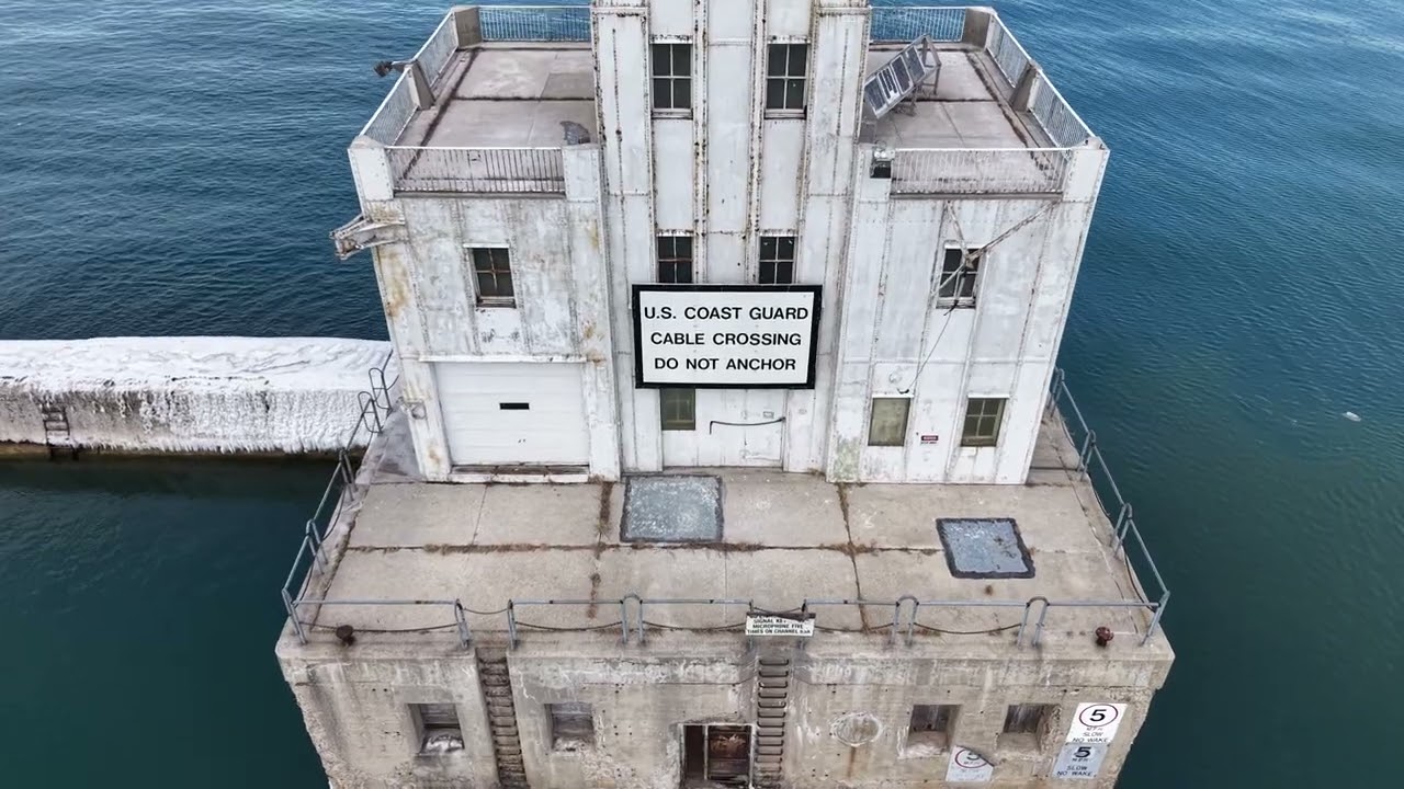 Milwaukee breakwall main gap lighthouse aerial video.