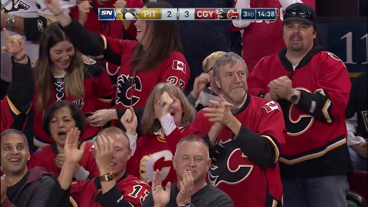 Gaudreau gets through the Pens' defense and scores with a wraparound