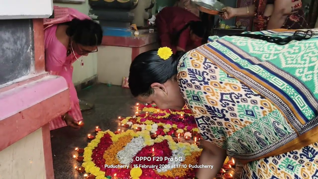 Shivlingam with flowers and deepams 108
