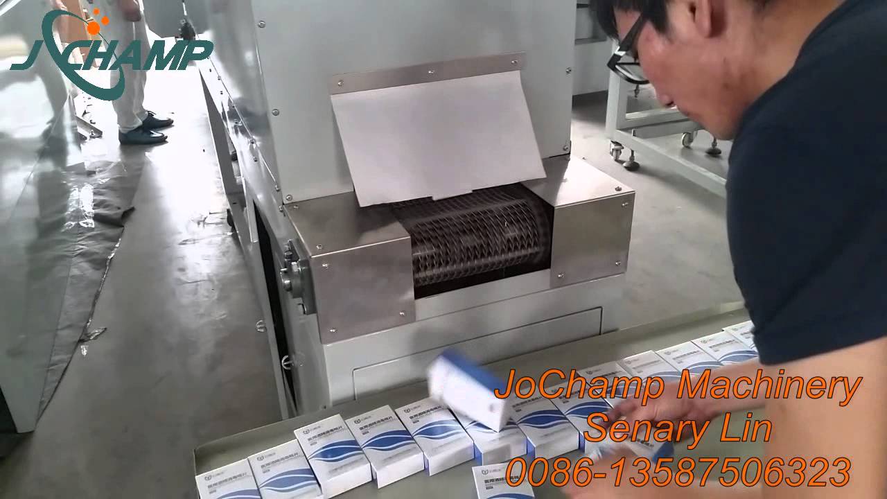 Medicine box heat shrink packaging machine