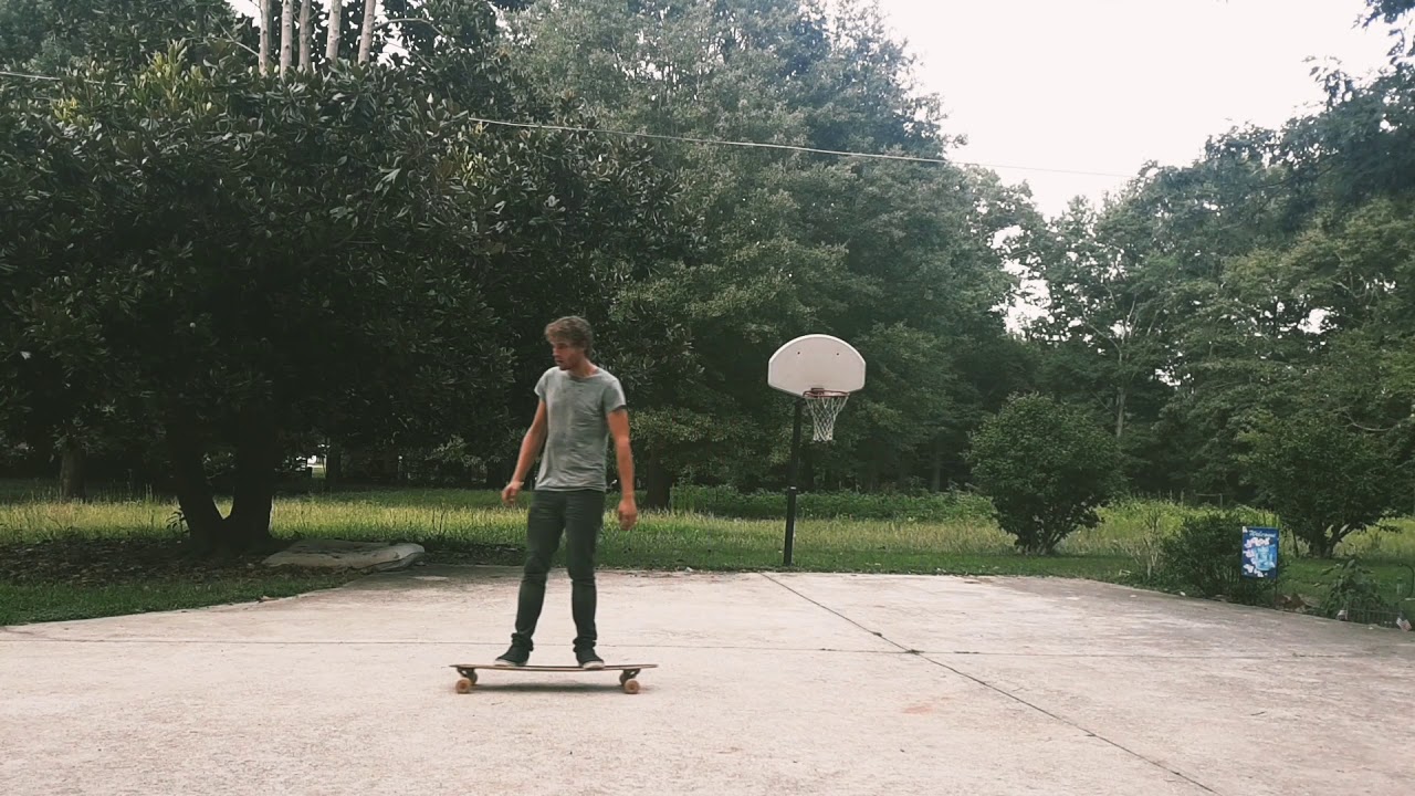 Longboard freestyle tricks on a pintail