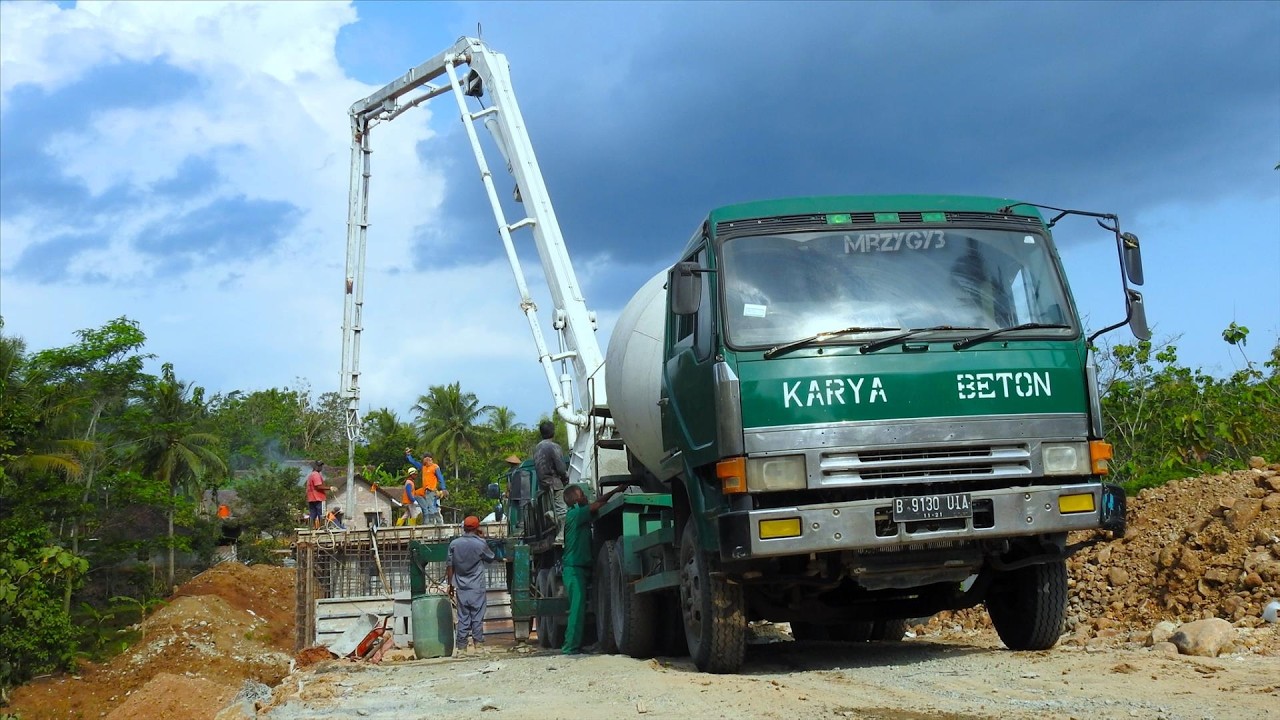 Ready Mix Cement Mixer Pump Trucks Pouring Concrete On The Bridge Construction