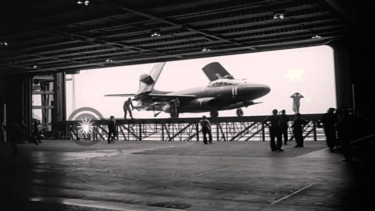 US FJ-2 Fury and F3D Skyknight on deck of USS Hancock CV-19 in the Pacific Ocean. HD Stock Footage
