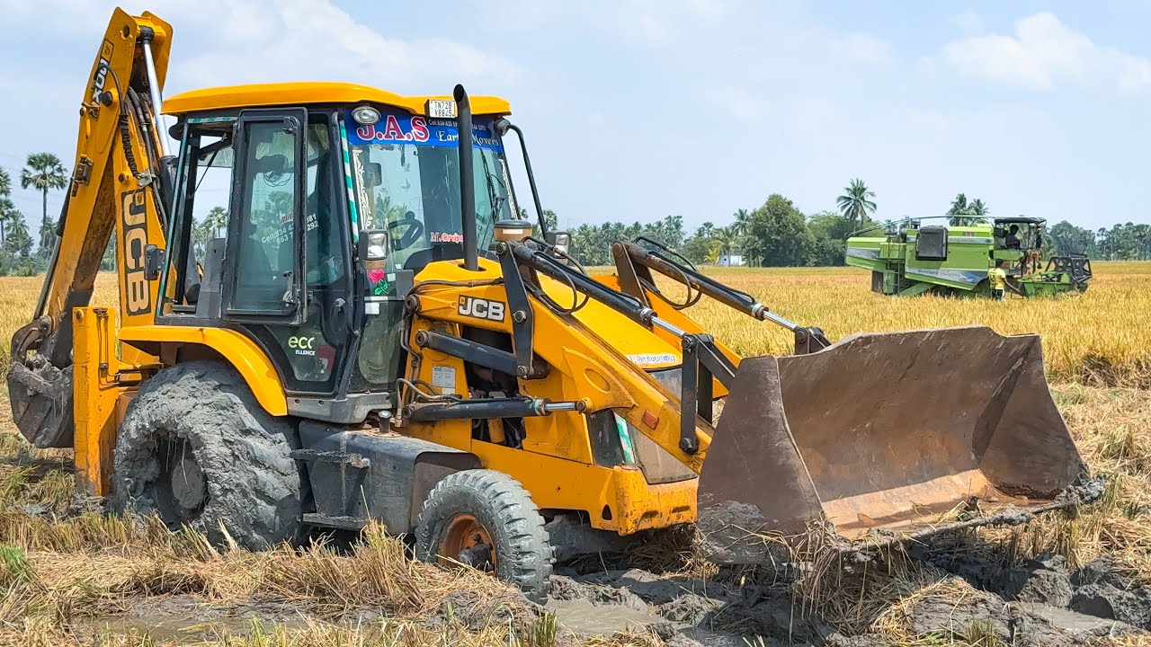 JCB 3DX Pulling out a Kartar Harvester Stuck in Mud the Middle Paddy field | Jcb video