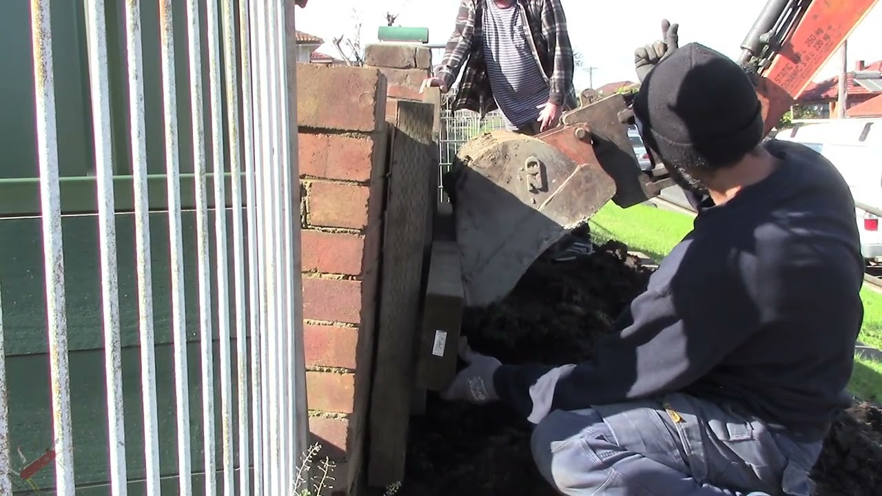 50 Year old Brick Retaining Wall leaning - can we fix it?  [Preview]