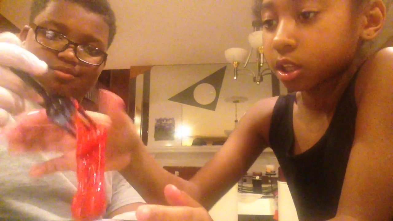 Reagan and CJ playing with slime
