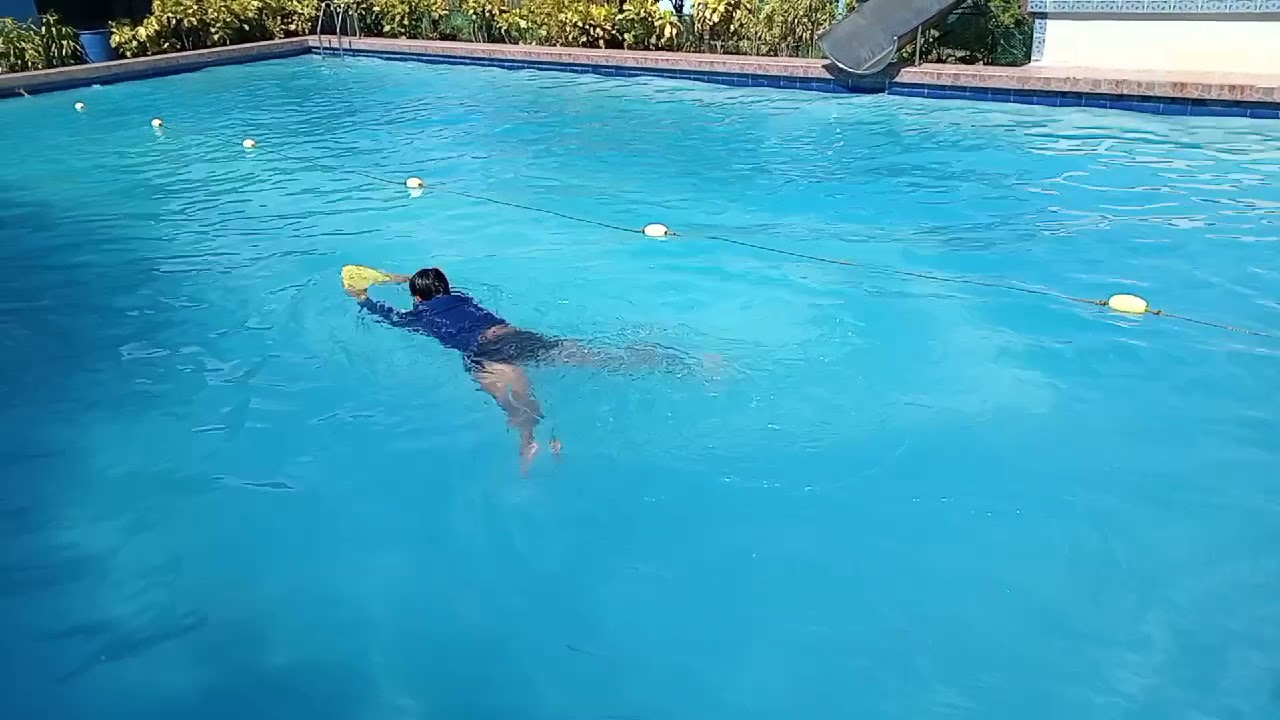 Breaststroke kick with Kickboard, free breathing