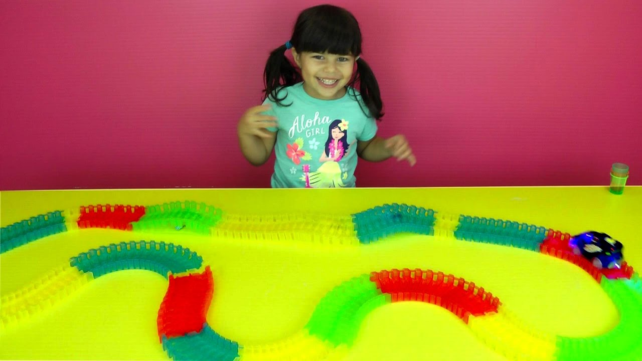 CAR on GLOW TRACKS! Bumpy ride! Shopkins ride on fast glow in the dark car - obstacles on track