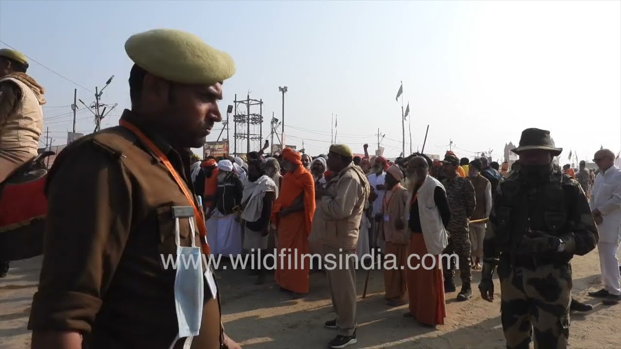Grand Sadhu Procession Scene with Security and Crowd at Kumbh Mela