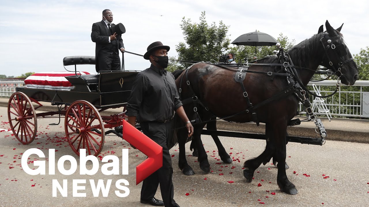 John Lewis’ funeral procession crosses the Edmund Pettus Bridge in Selma, AL