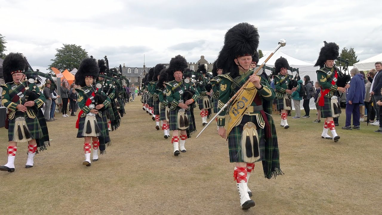Drum Major Derek Dean leads Huntly Pipe Band on the march during the 2022 Aboyne Highland Games