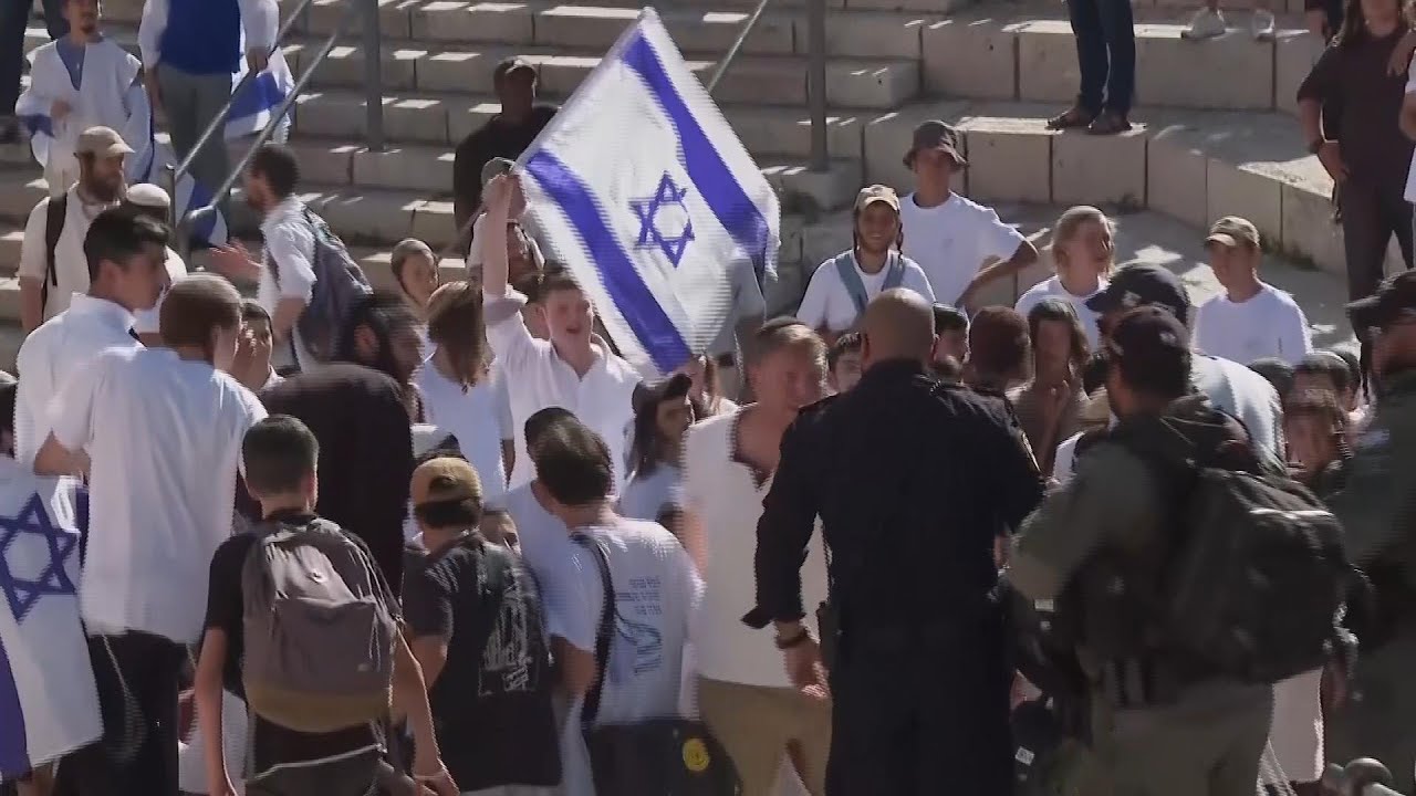 Israeli nationalists march through Palestinian area of Jerusalem, some chanting 'Death to Arabs'