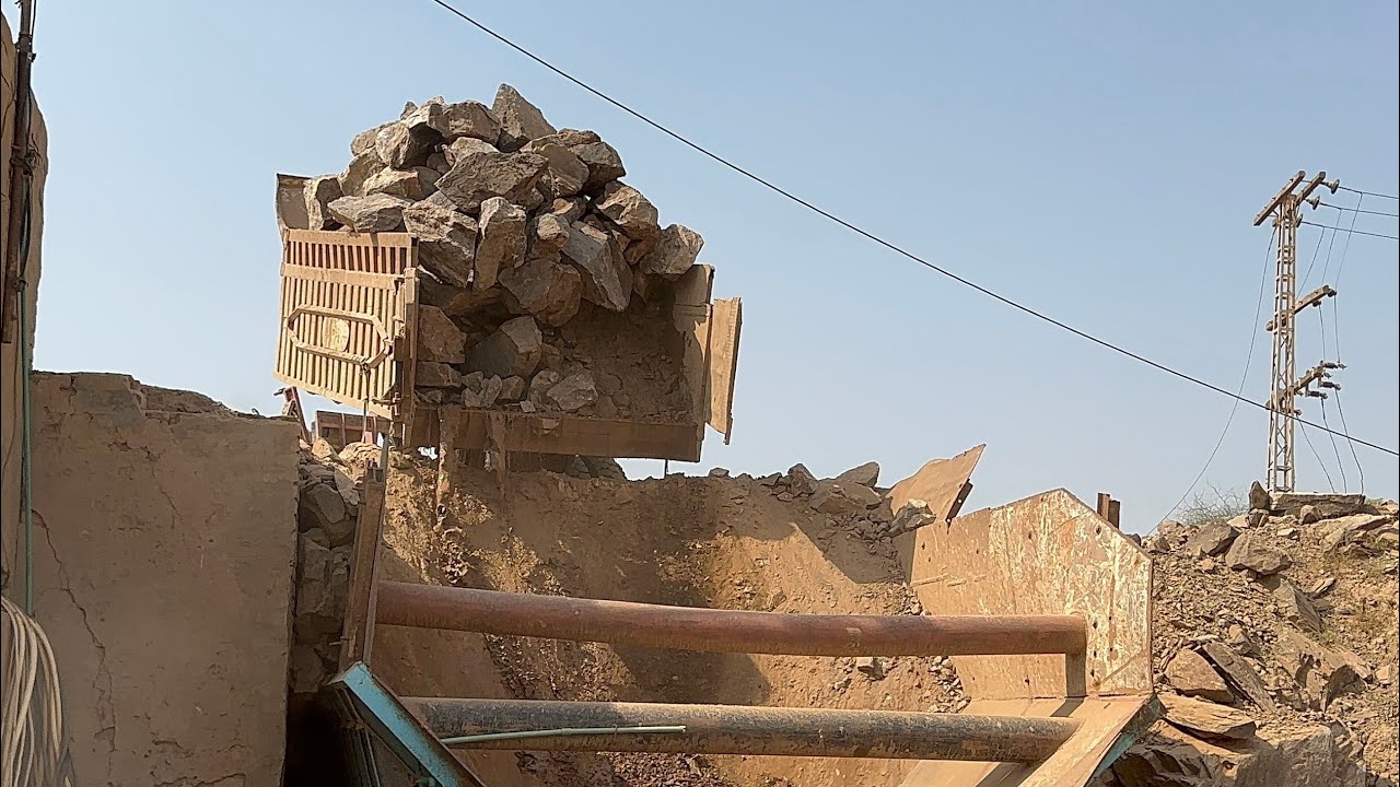 "Stone Crusher Machine: A Giant at Work"The Power of Stone: Machine Working in Action"