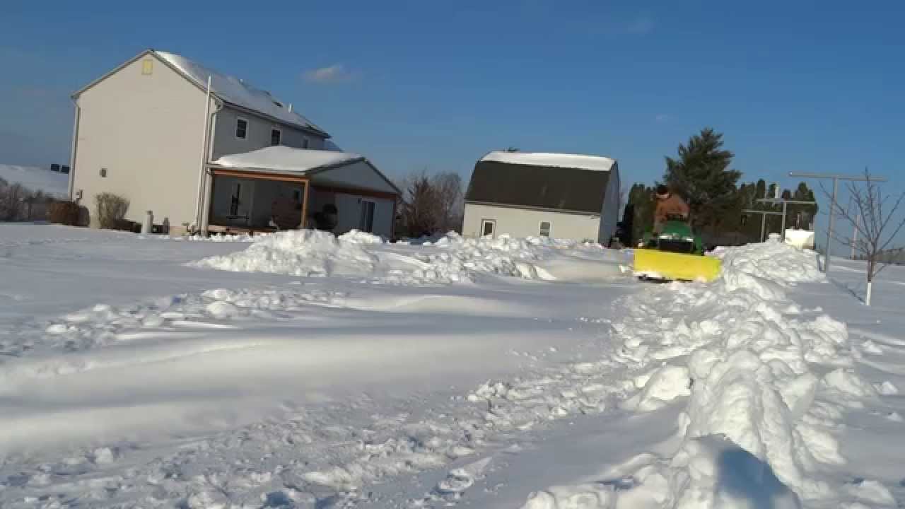 John Deere x585 Pushing Snow