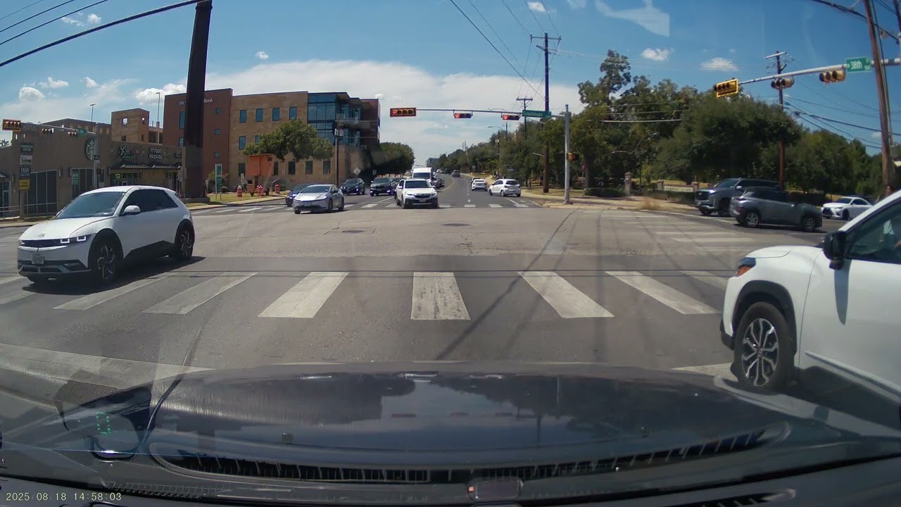 Postal truck and car behind run left turn on red