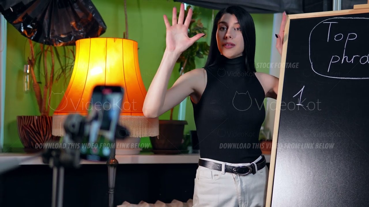 Slow motion of shy woman trying to film lecture standing in front of camera but failing