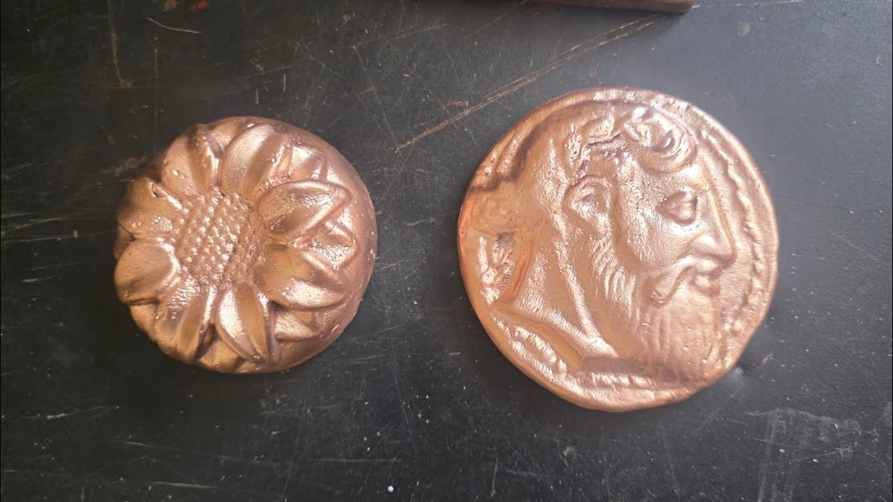Melting copper ingot's into a sunflower and a copper coin. 