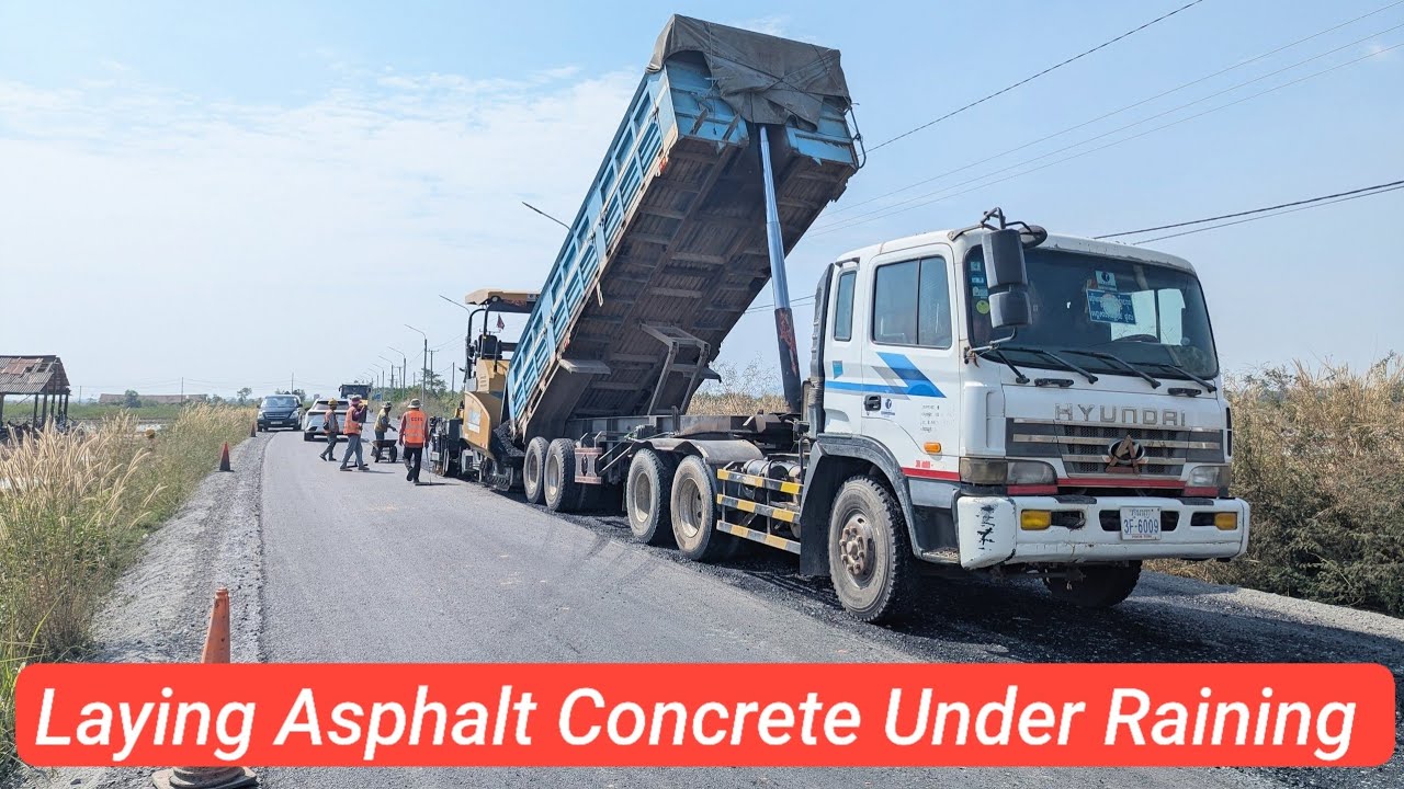 Laying Asphalt Concrete Pavement Under Raining, Incredible work.