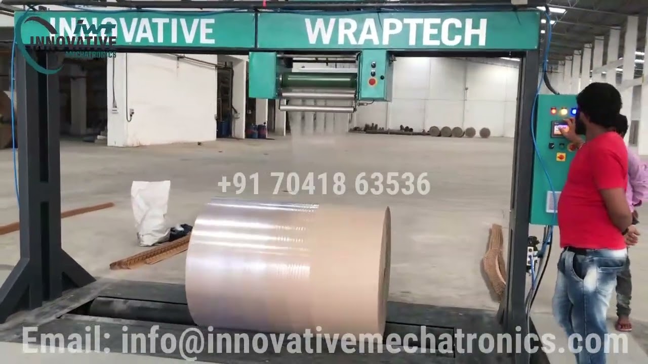 Radial type paper reel stretch wrapping machine | radial type paper roll packing machine