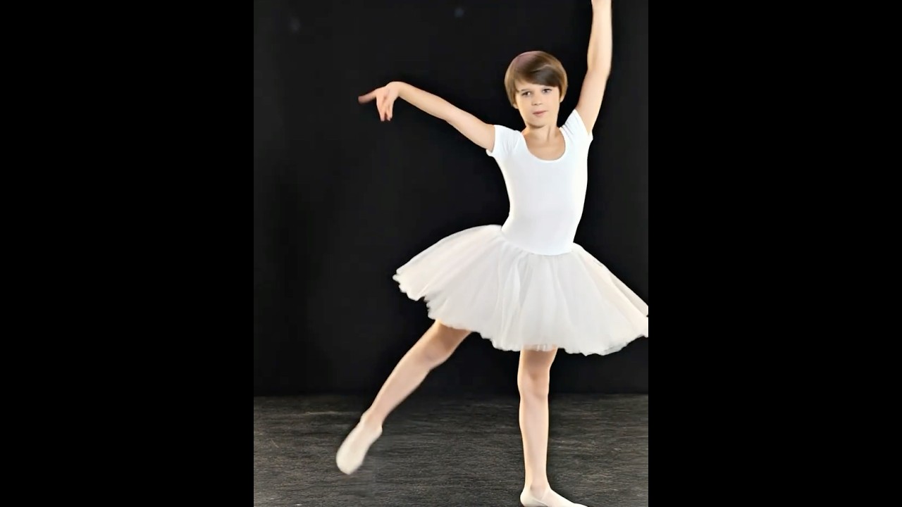 A boy in a ballet tutu dancing silly