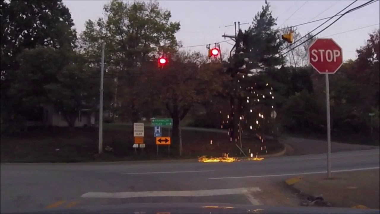 Dashcam.  Electric Pole Falls In to Pine Tree, Starting Fire