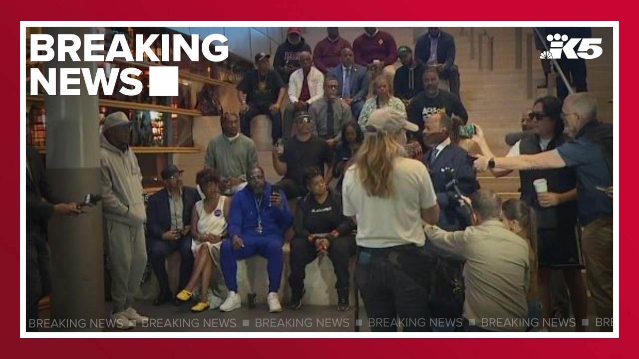 BREAKING: Group protests ouster of SPD Chief Barnes at City Hall