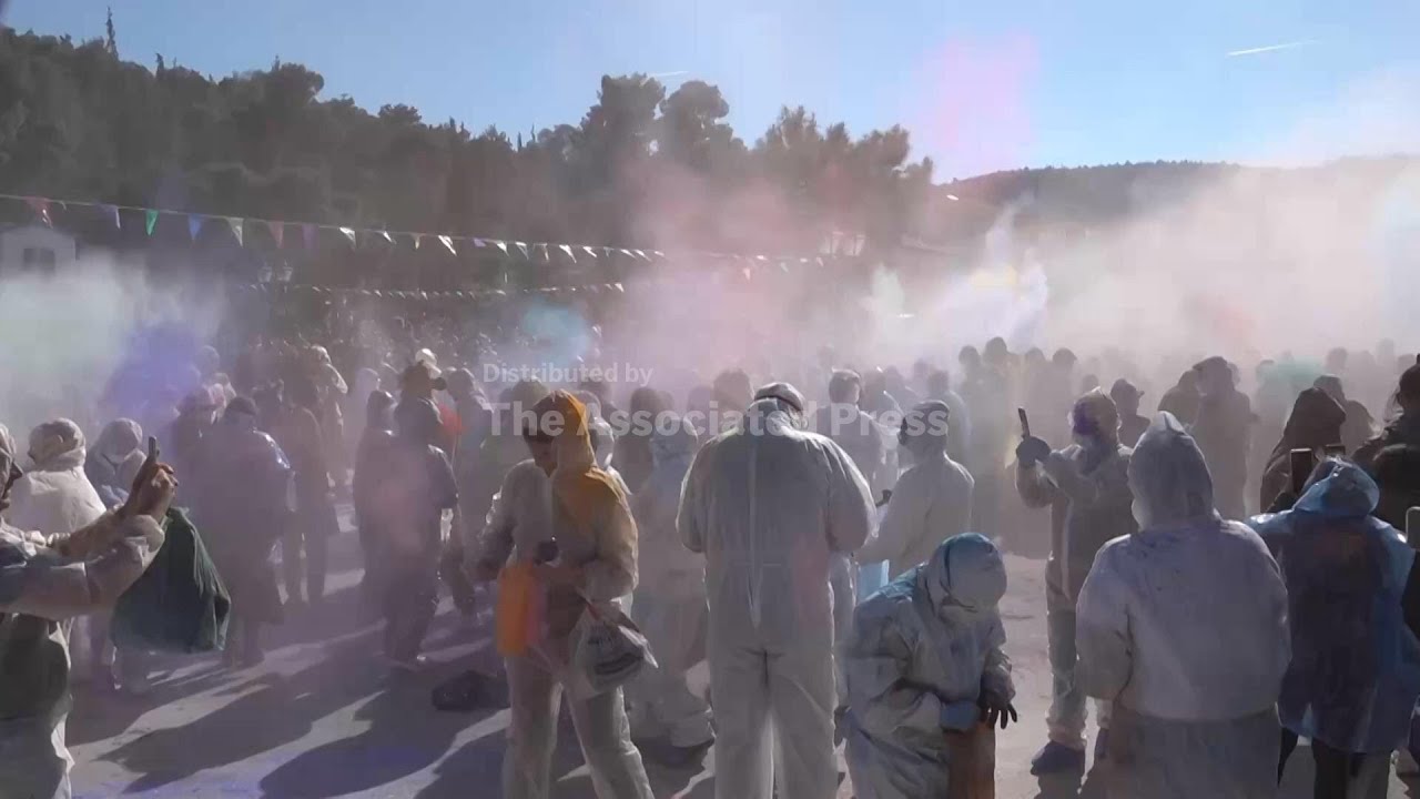 Greeks throw flour at each other to mark the end of carnival