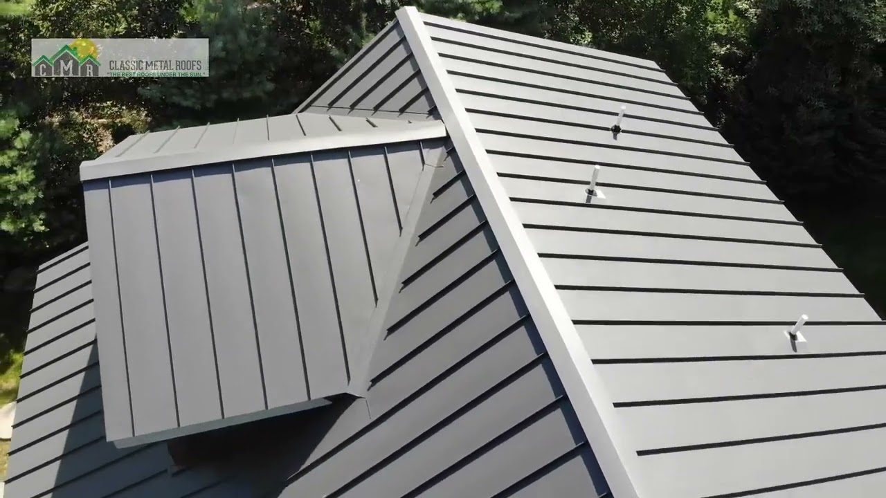 See a Log Home with a Standing Seam Metal Roof in Dark Bronze in Webster Massachusetts