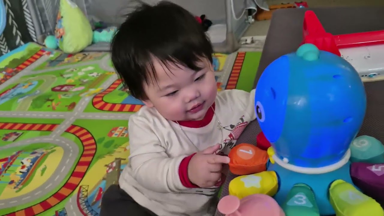Baby Rohan's cousin having fun playing toys 