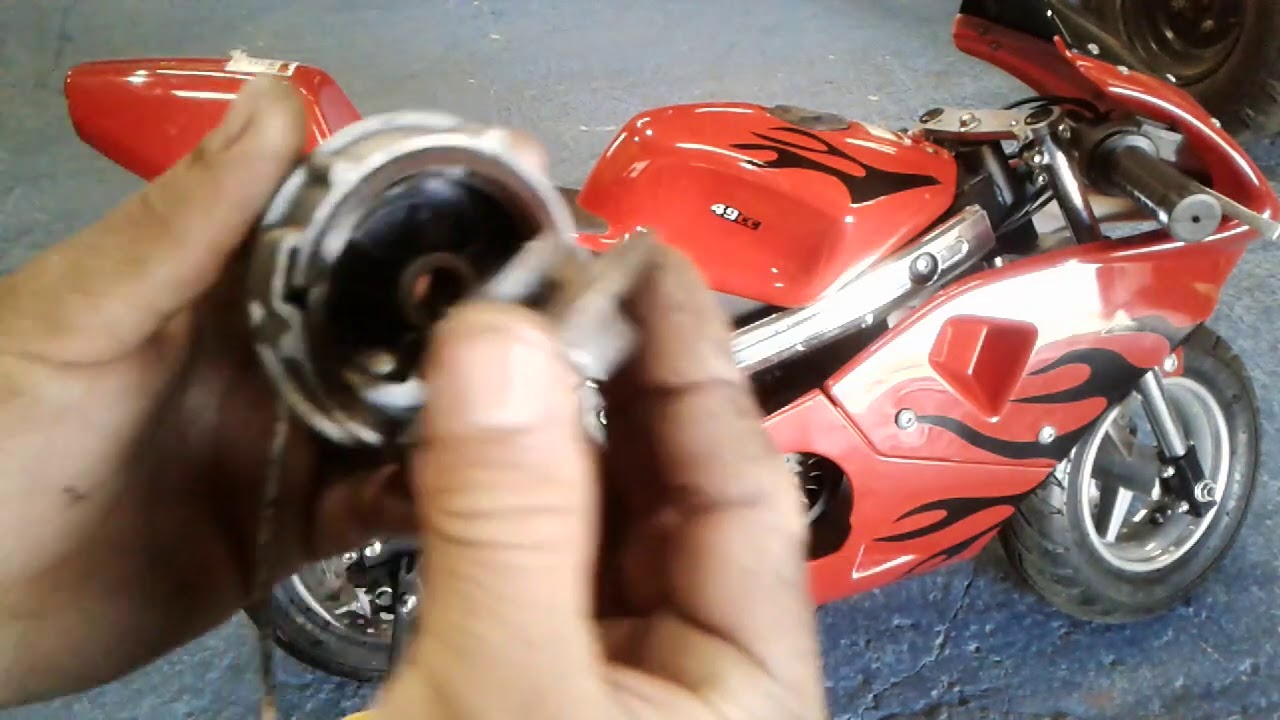 Como montar  a cordinha e a mola da partida  da mini moto facil e simples