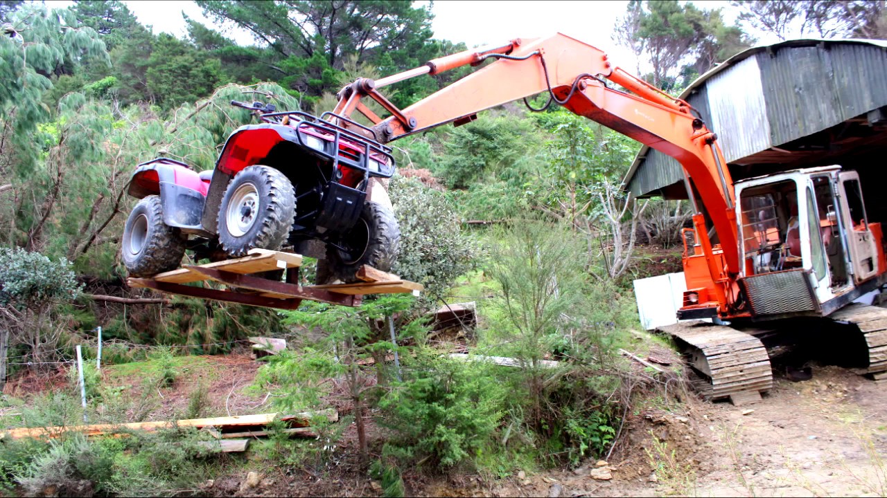 Modified tractor forks to fit an excavator bucket