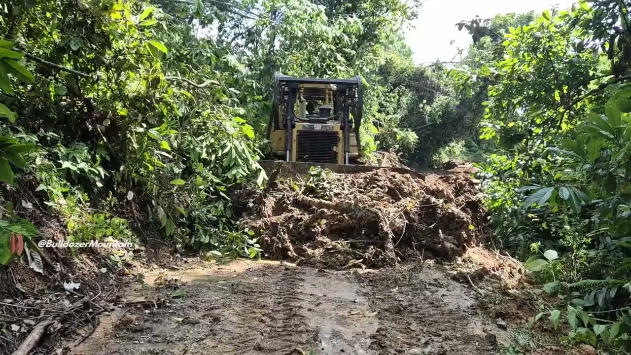D6R XL Bulldozer:  Precision & Power on a Mountain Road