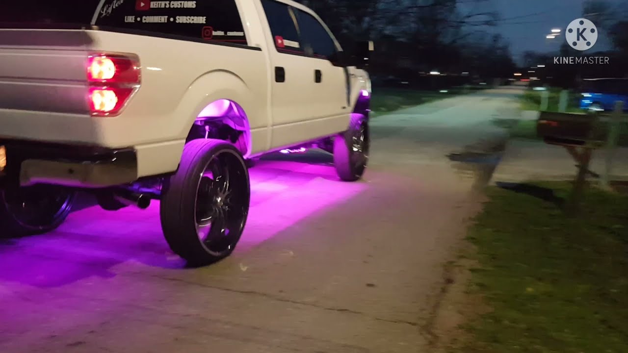 Lifted Ford F150 on airbags and 30 inch wheels...