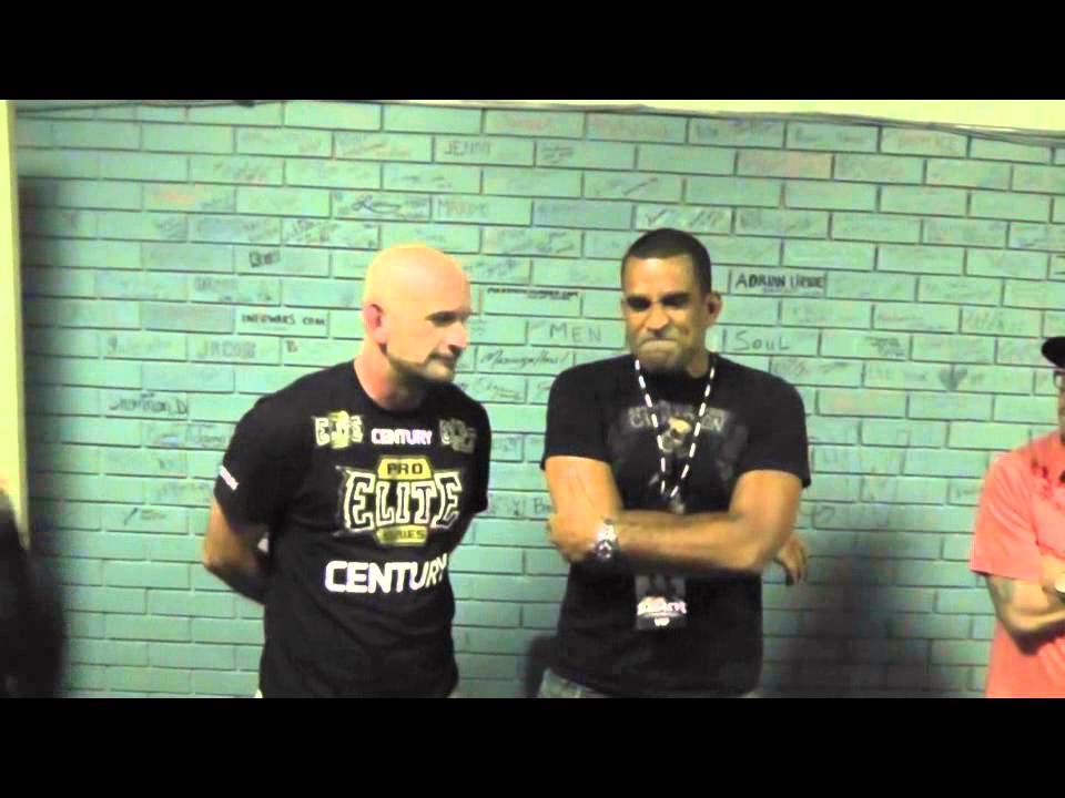 Renato Laranja shows Greg Jackson the finer points of coaching