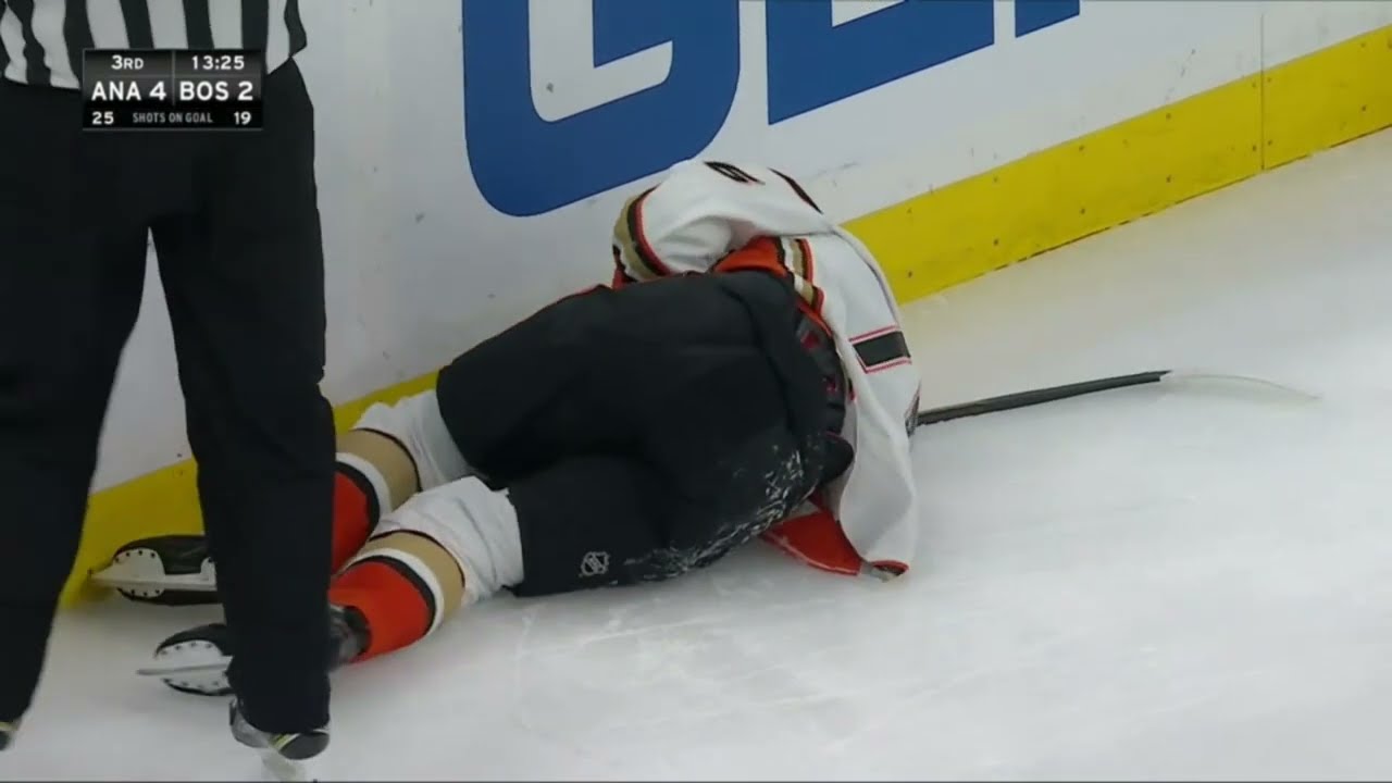 Josh Mahura down in pain after crashing hard into goal post