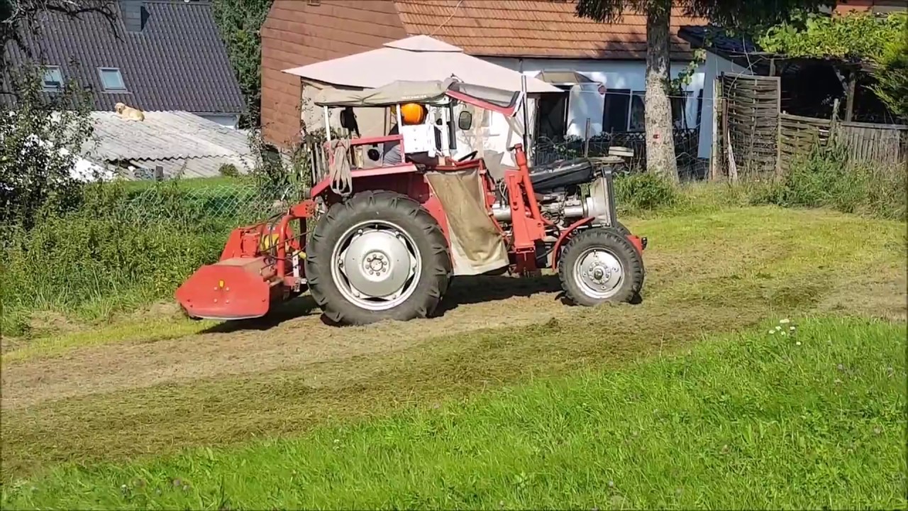 MF 133 mit Schlegelmulcher
