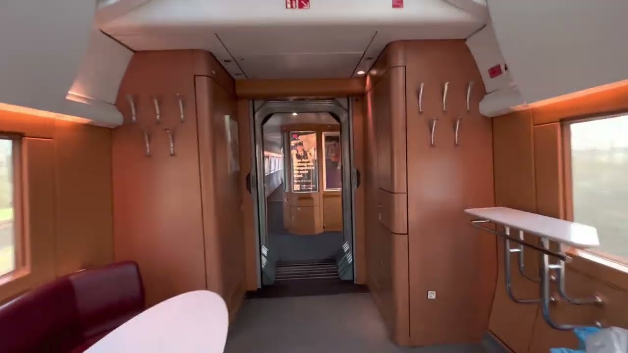 A first class compartment and restaurant in a moving ICE train
