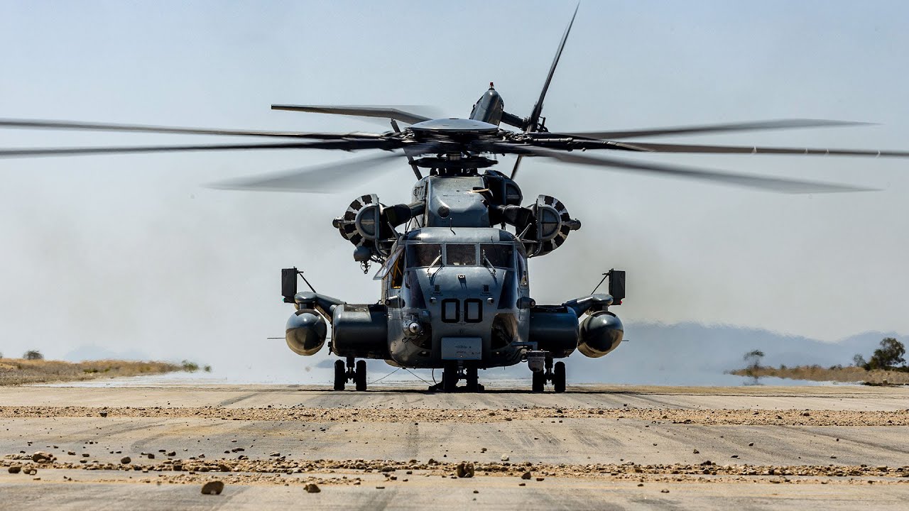 U.S. Marines transport troops during a training flight in a CH-53E Super Stallion