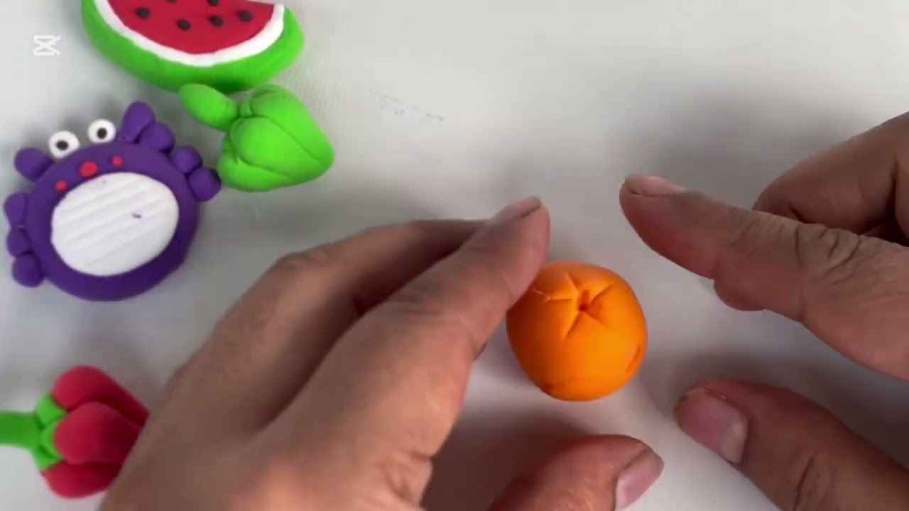 “A tiny orange made with clay 🍊”#ClayArt#MiniOrange#HandmadeCraft