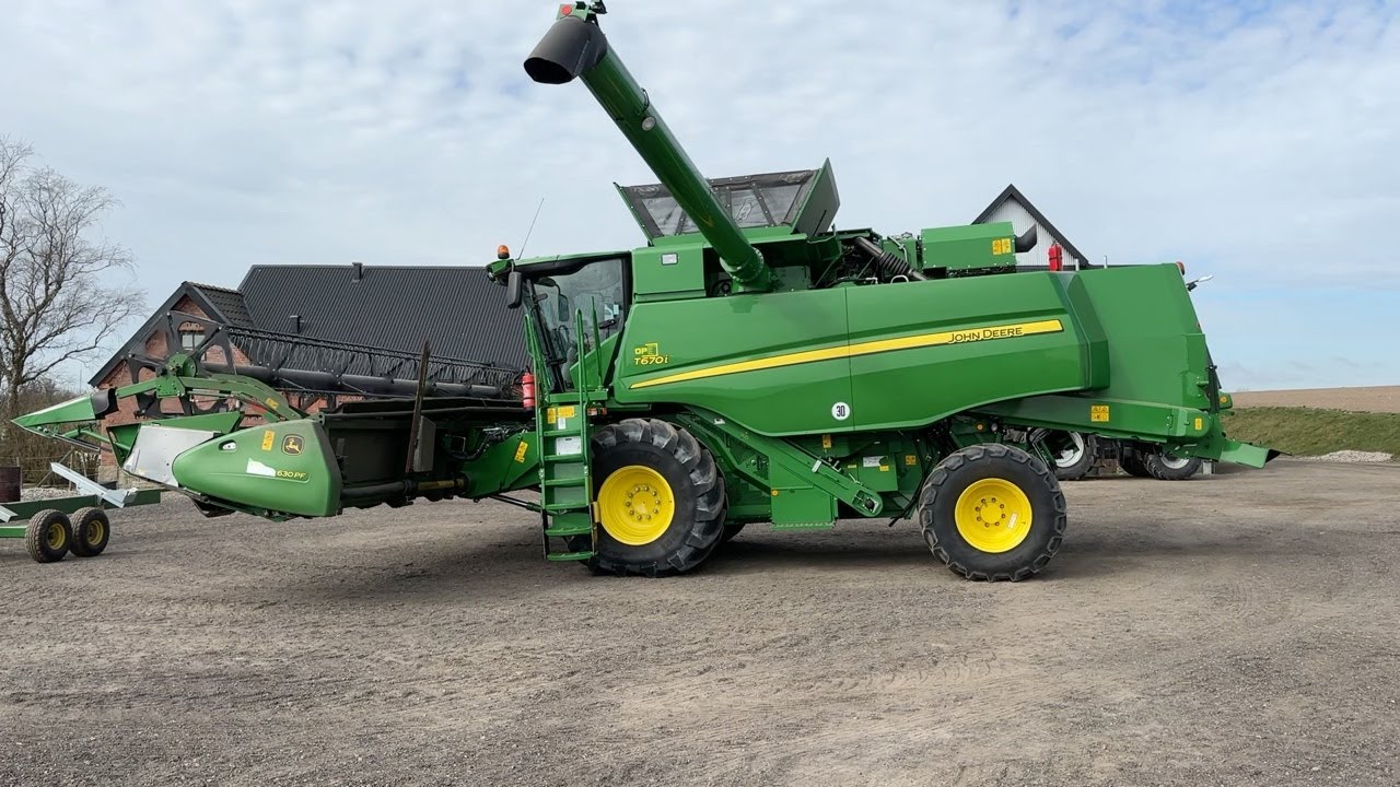 Köp Skördetröska John Deere T670i med 630 PF skärbord och vagn på Klaravik