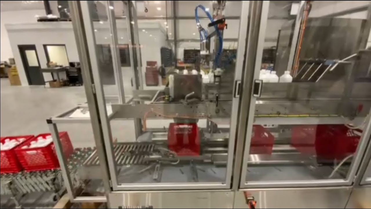 Hamrick Packaging Systems - 600D-S Case Packer for a Dairy Company Packing into Plastic Crates