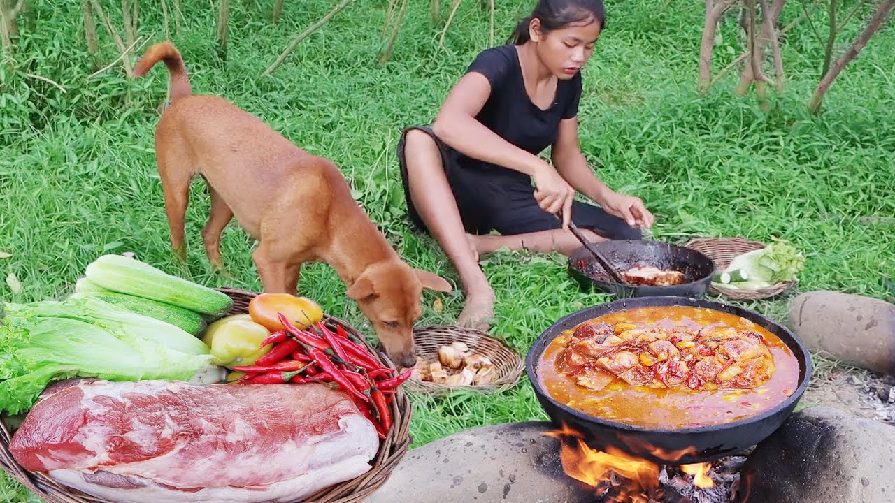 Survival cooking in the forest - Pork salad braised spicy delicious for food with dog