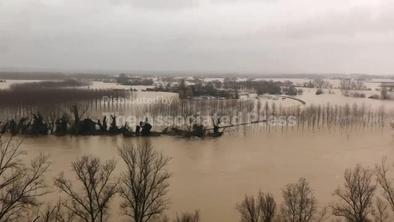 Rescuers operate in small boats in flooded southwest France following deadly storm