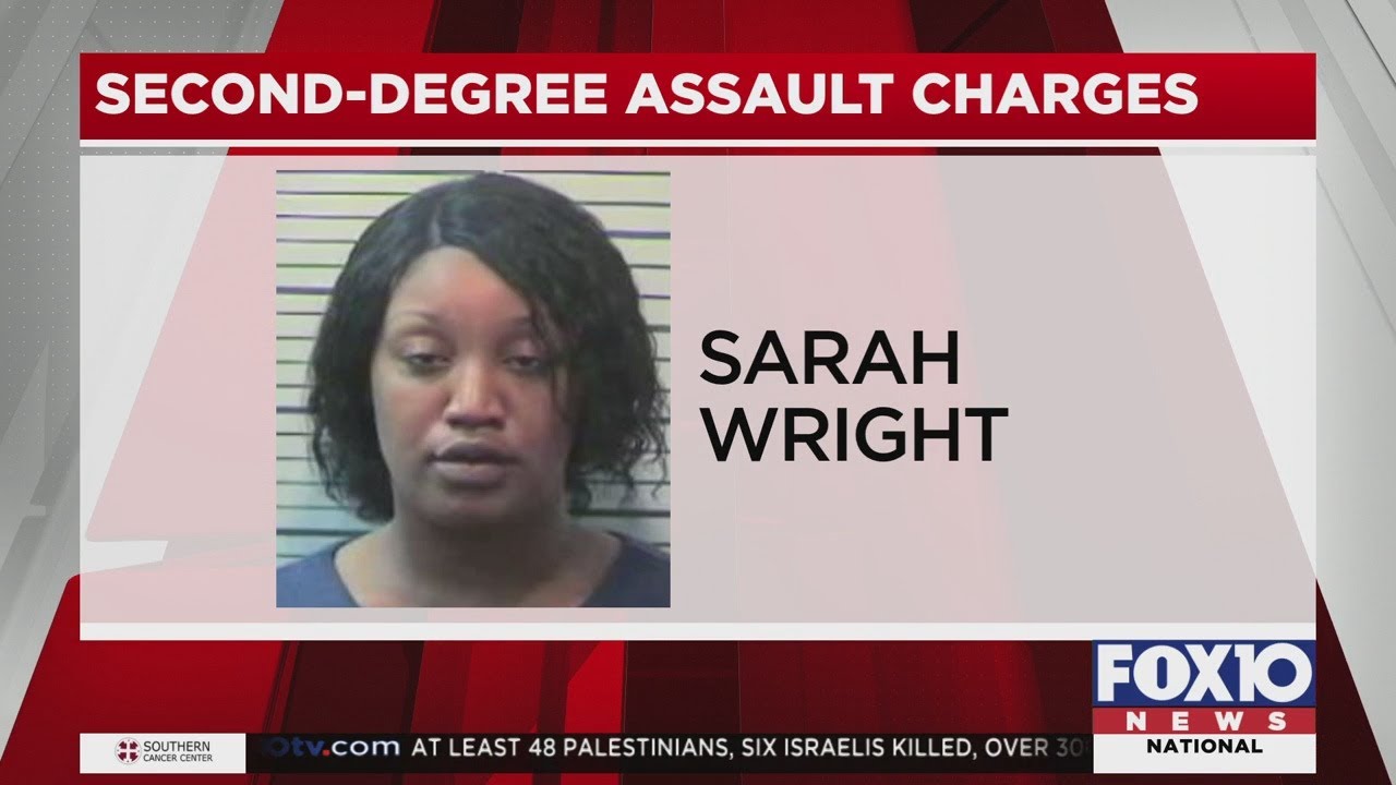 Woman accused in shooting surrenders to police