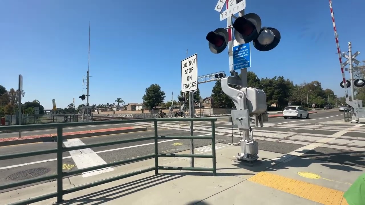 Southbound Metrolink at Harvard crossing in Irvine CA on the way to the Irvine train station 5/18/24