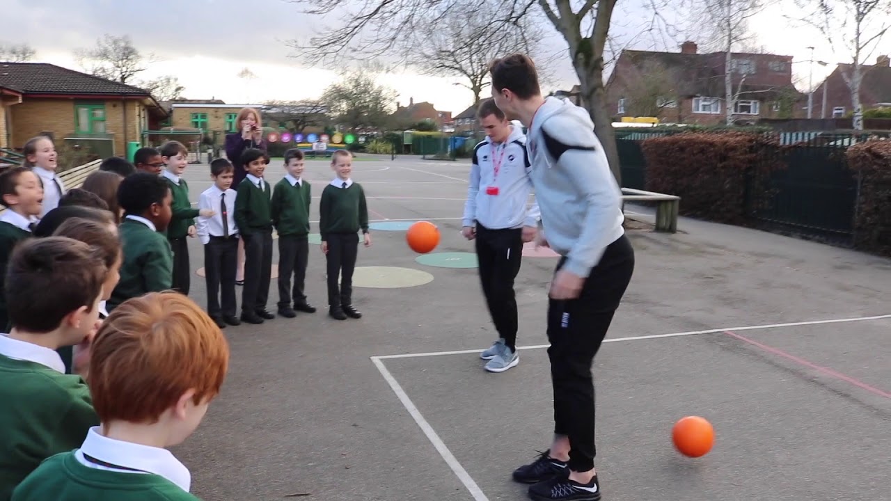 Millwall players surprise school students