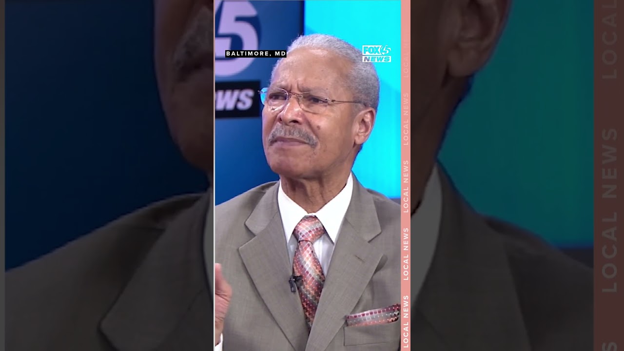 Pastor P.M. Smith reacts to Sheila Dixon being called a 