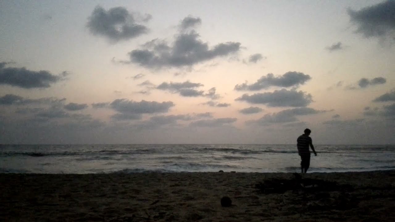 Sunset amidst running waves & dancing clouds..A timelapse