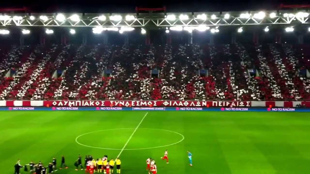sportstonoto.gr | Olympiacos vs Manchester United: teams entering pitch and fans' coreo