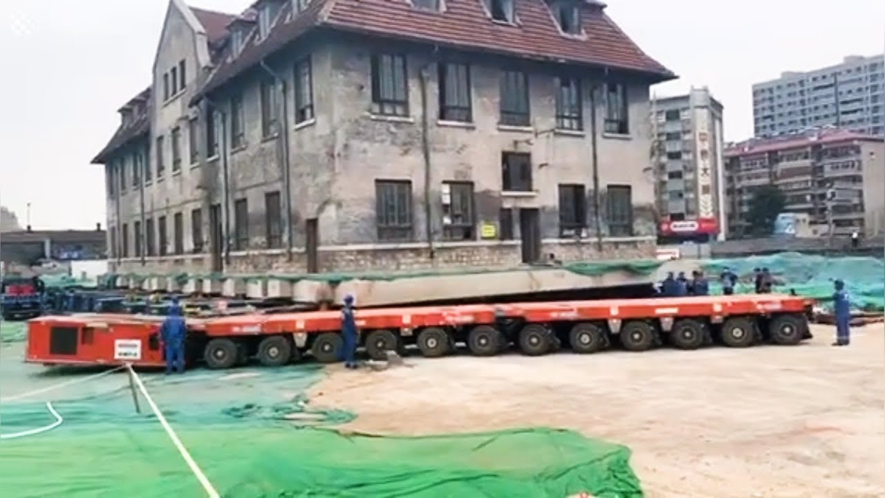 Chinese city relocates 100-year-old nunnery using self-propelled modular transporters.